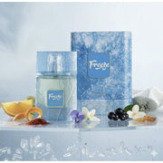 Der eisblaue, moderne Flakon von Riiffs Freeze Extrait de Parfum 100 ml neben der originalen, eleganten Verpackung von Dinar Parfums Wien.