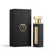 Schwerer matt-schwarzer Luxusflakon des Reef Perfumes Reef 15 Eau de Parfum 100ml mit goldener Metall-Plakette vor elegantem Hintergrund – exklusiv bei dinar.at